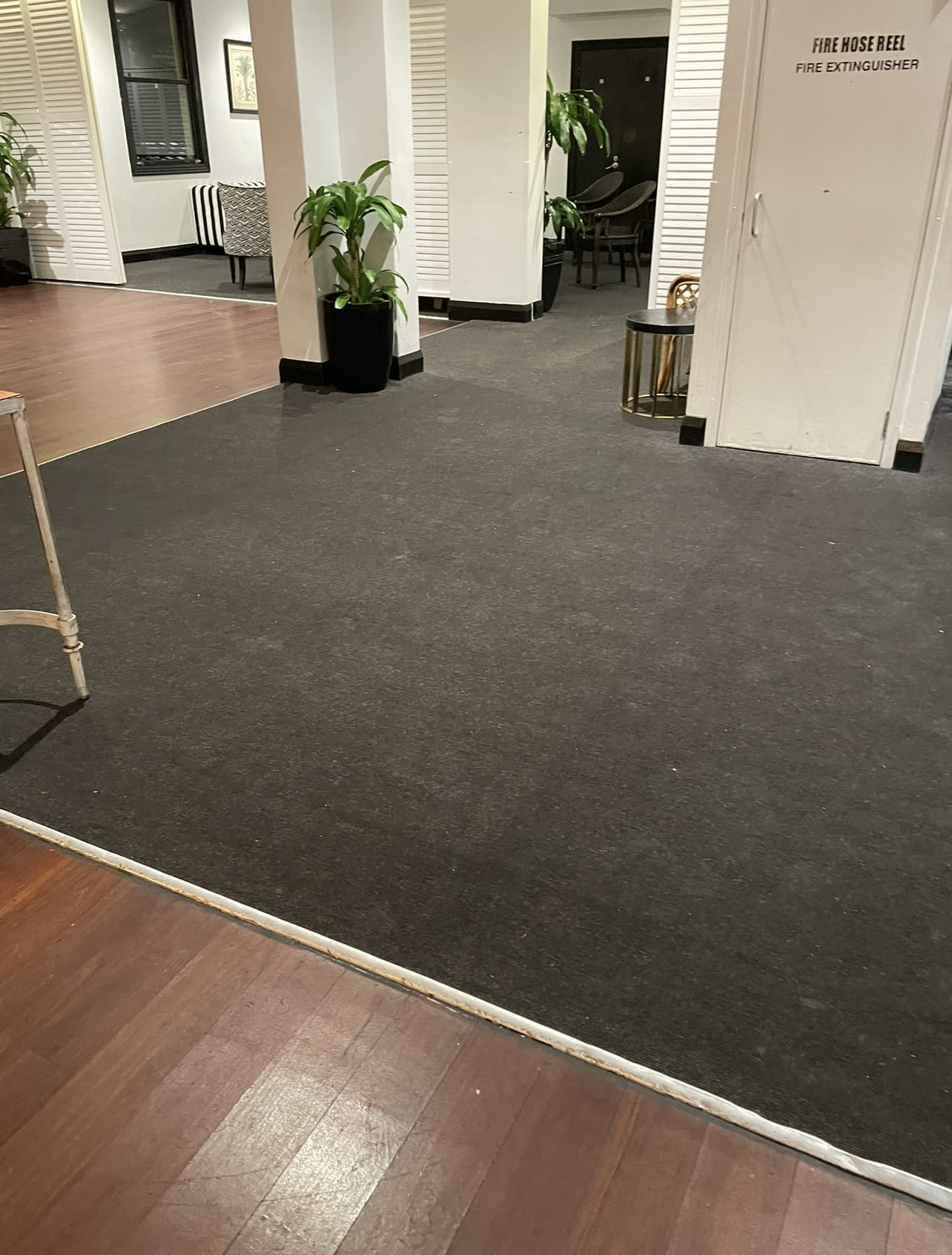 Clean carpet and timber floor in a commercial foyer