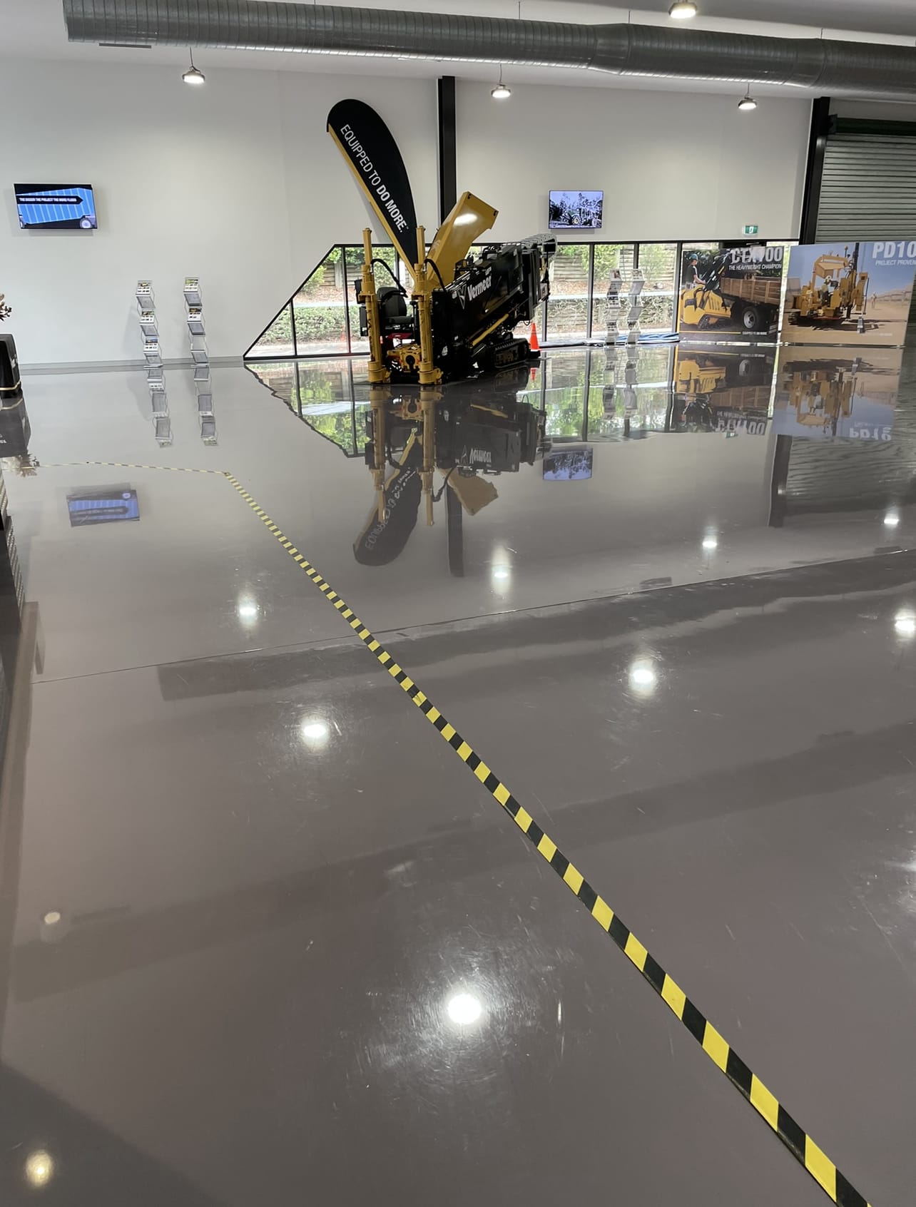 A mirror-gloss commercial floor stripped, sealed and polished by Cheetah Maintenance